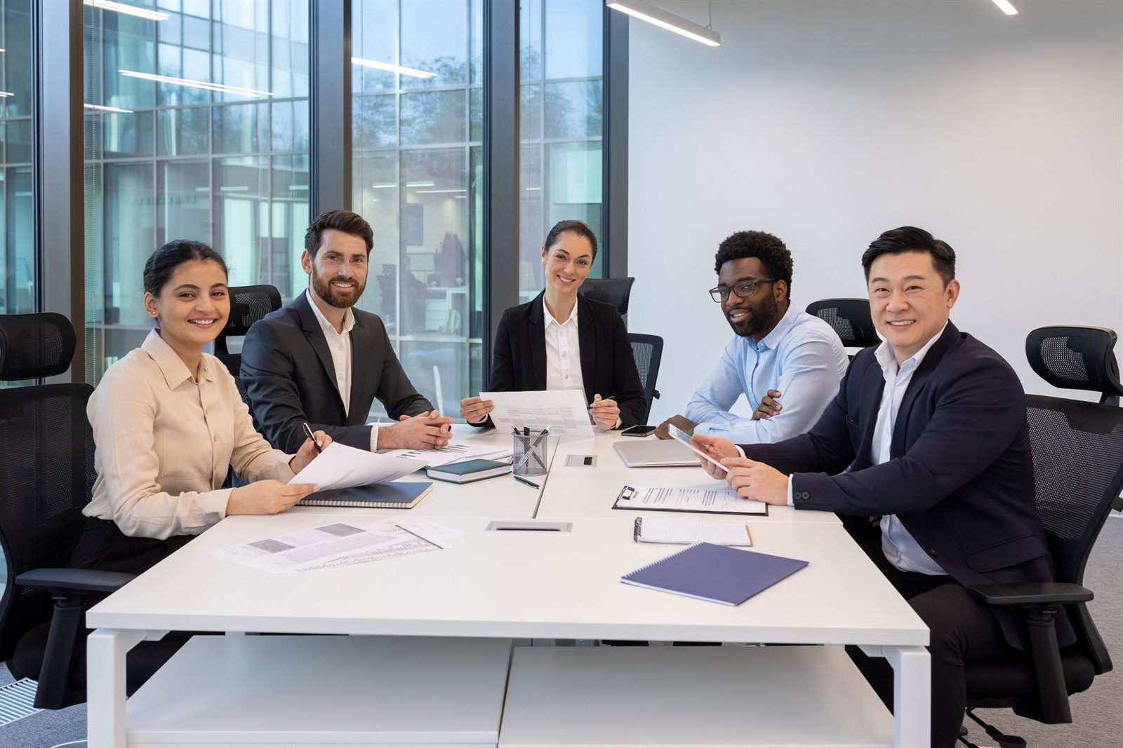 Professional team seated at a table for Garner Industrial Solutions contact page